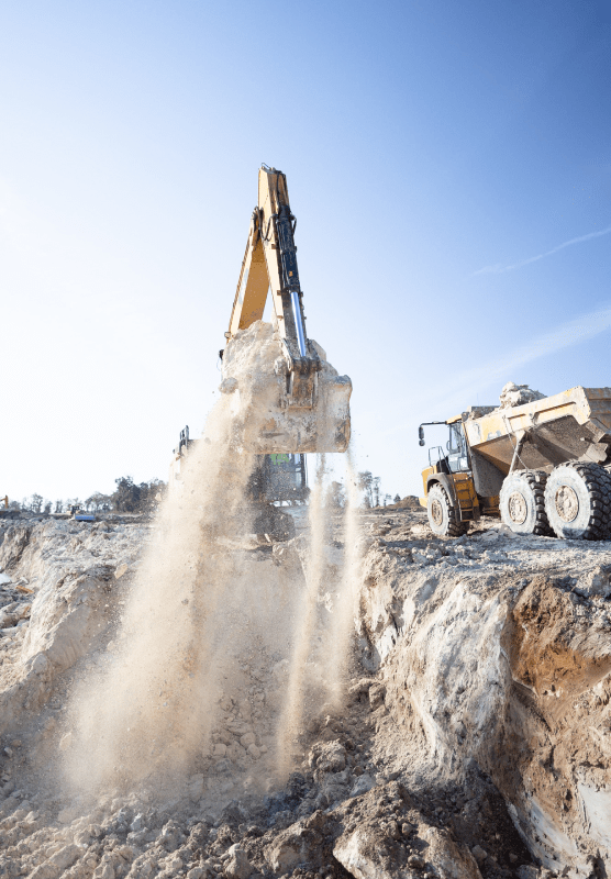 HBC, portrait, bright shot, excavator bucket lifitng dirt, smokey dirt, truck on right of image, changing-the-landscape.png, Services