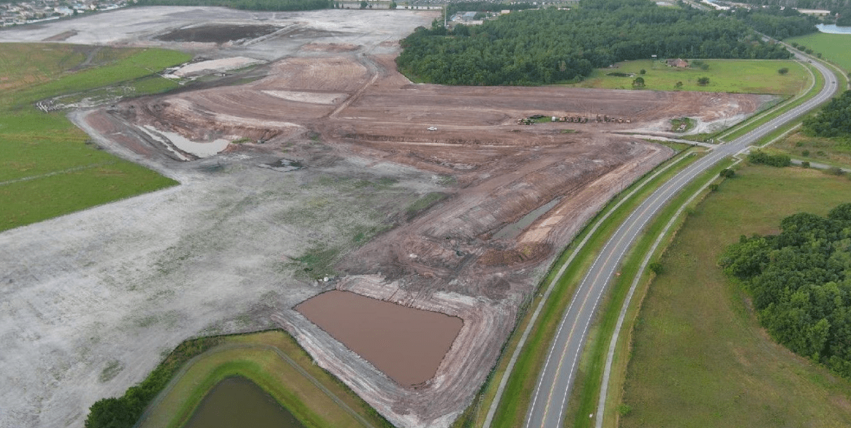 HBC, drone shot, dirt worksite, mud, road on right, greenery on right, ham-brown-reserve-featured.png, Projects