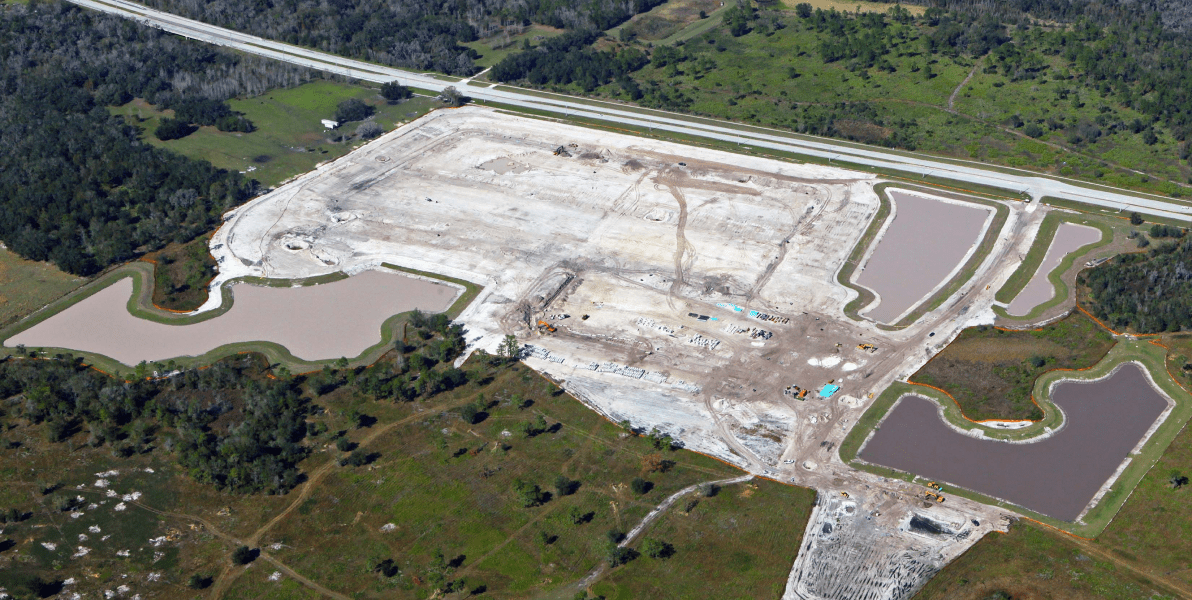 HBC, drone shot, greenery surrounding white and gray worksite, road in background, hawthorne-featured.png, Projects